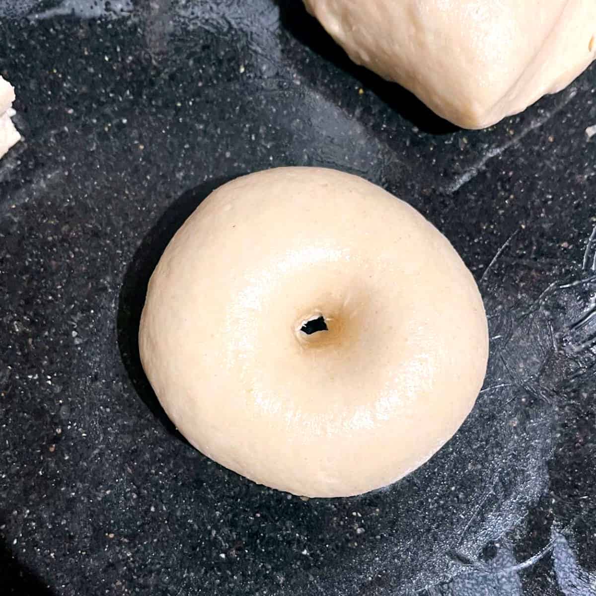 Bagel round with hole in center.