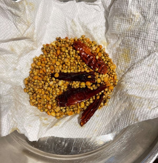 Roasted spices on paper napkin for vangi bath