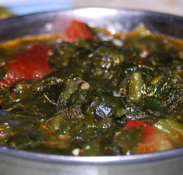 Spinach Kootu in bowl with tomatoes