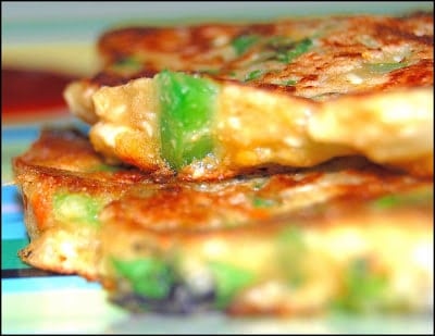 Savory vegan pancakes stacked in plate.