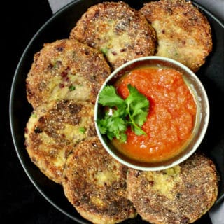 Delicious and crispy, these Mexican Potato and Bean Cakes served with a fresh tomato sauce are the perfect appetizer or snack -- but they are nutritious enough to make a great meal too! #vegan #mexican #cincodemayo #potatoes HolyCowVegan.net