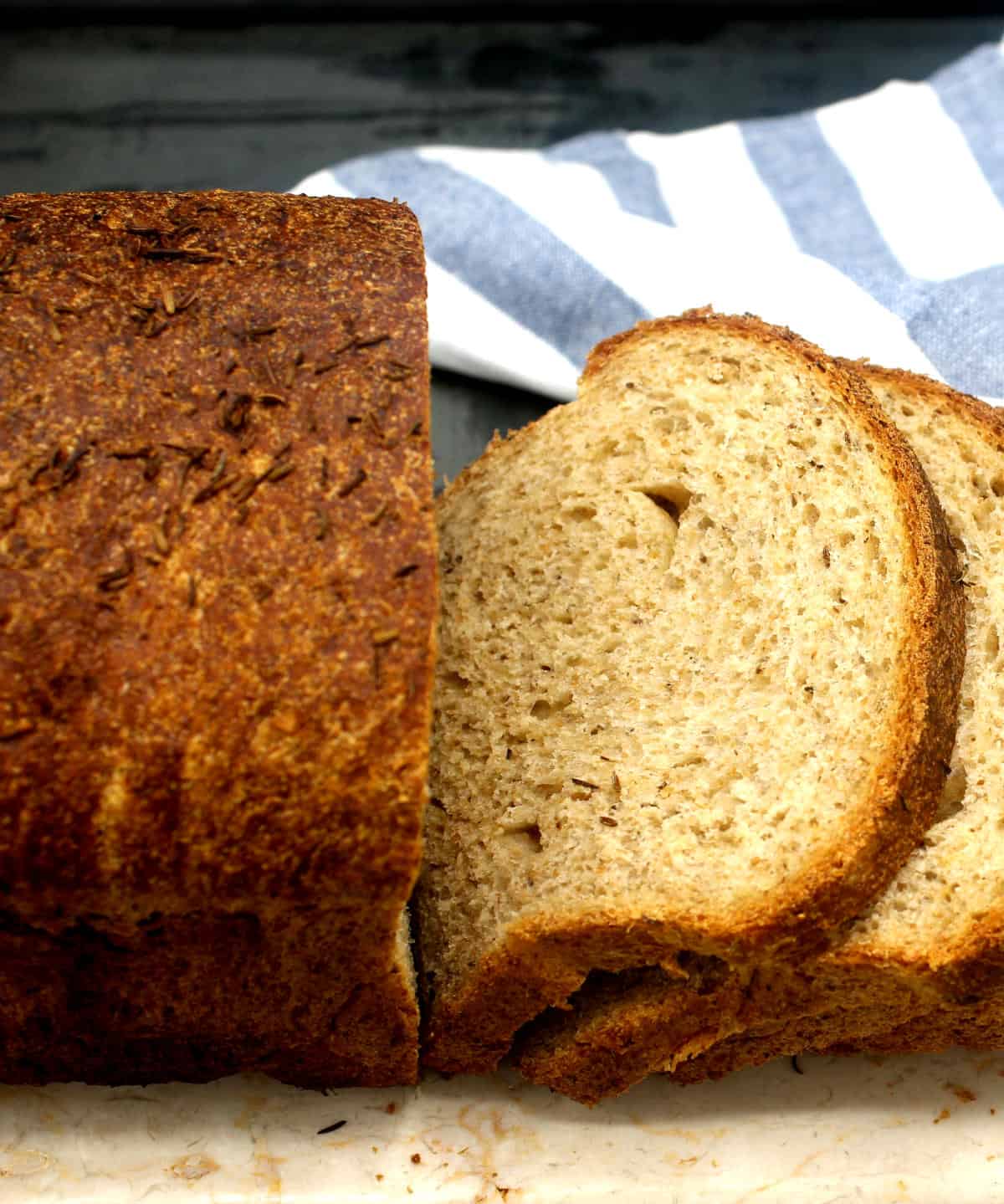 A sliced loaf of rye bread.
