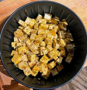 Tofu for tofu patio in an air fryer basket
