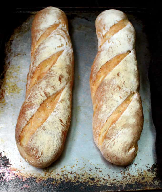 Two loaves of easy French bread on baking sheet.
