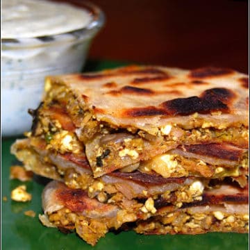Vegan murtabak cut into pieces with the stuffing showing