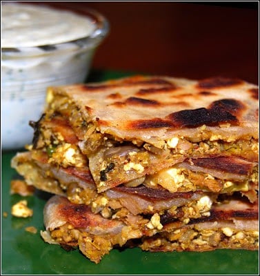 Vegan murtabak cut into pieces with the stuffing showing