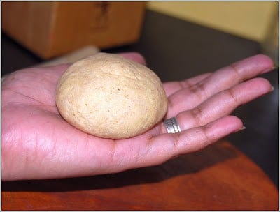 Trinidadian Roti dough formed into a ball with stuffing.