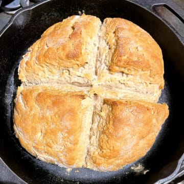 Vegan Irish soda bread in cast iron skillet.