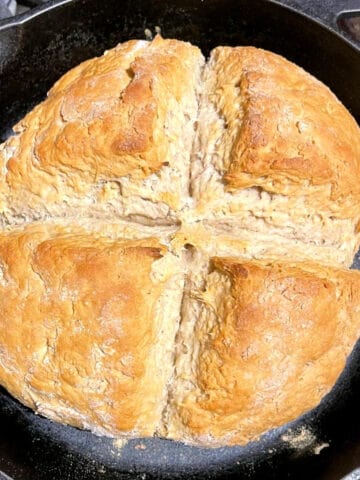 Vegan Irish soda bread in cast iron skillet.