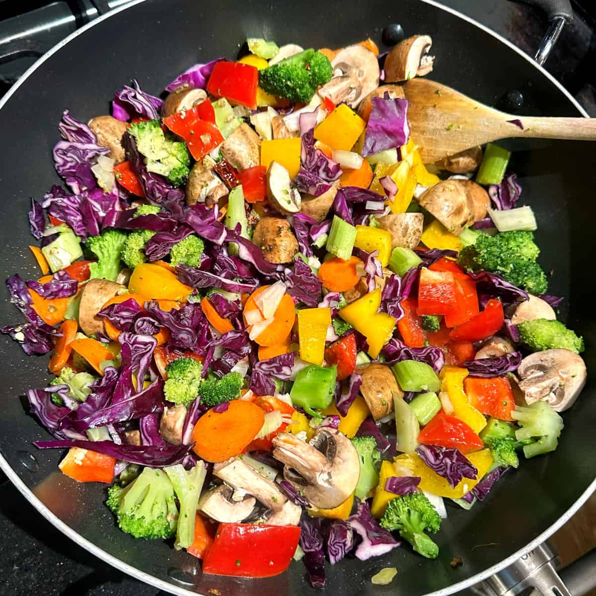 Vegetables added to the wok.