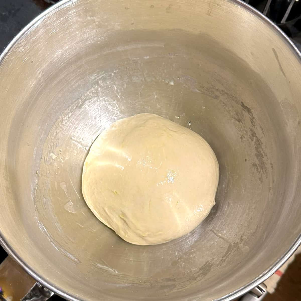 Dough ball for crescent rolls in bowl before rise.