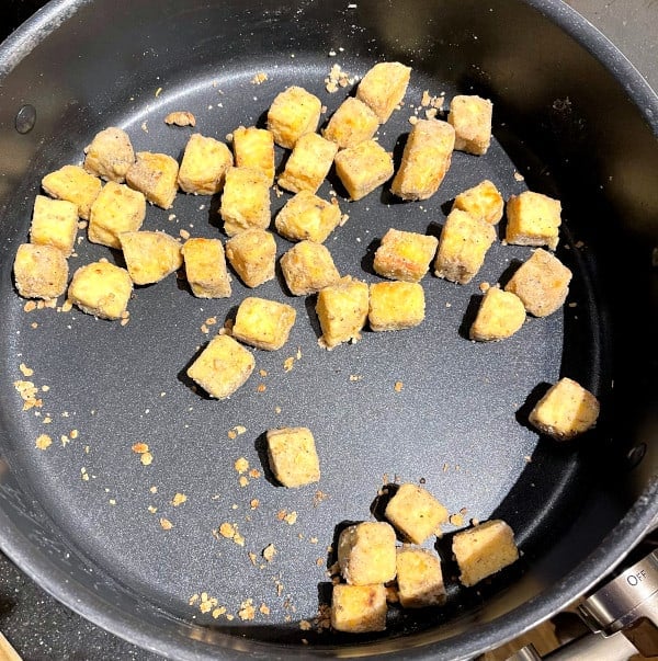 Tempeh cubes sauteed in skillet