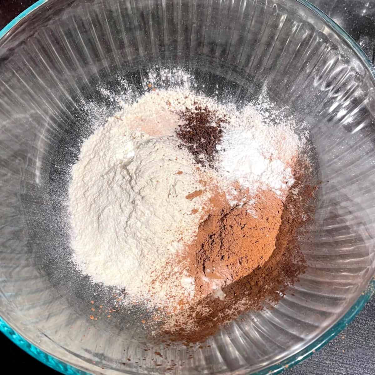 Dry ingredients for vegan Irish cream cupcakes in bowl.