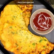 Black plate with besan chilla with red sauce and text says "Besan Chilla, Indian Vegan Omelet".
