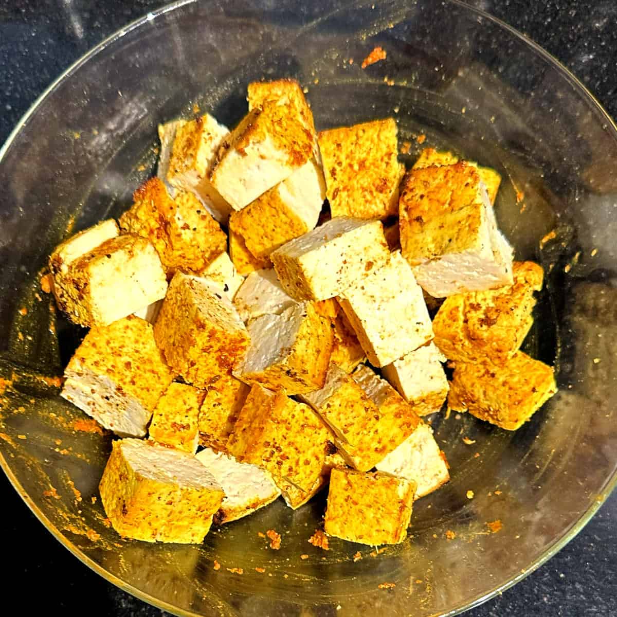 Cubed tofu in bowl.