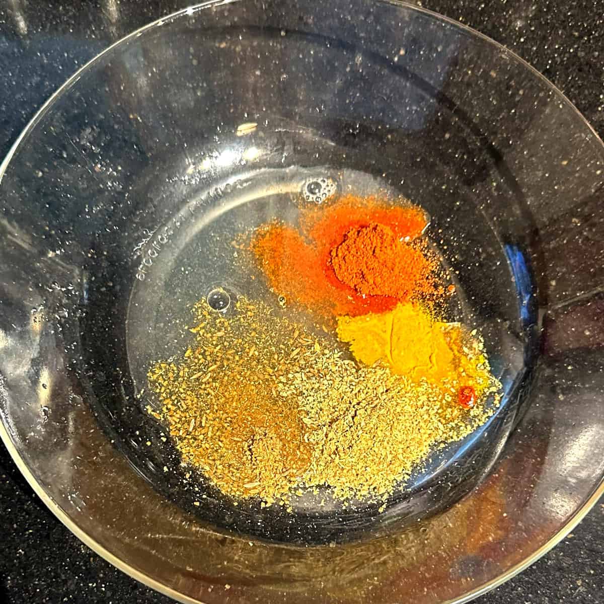 Spices and lemon juice in bowl.
