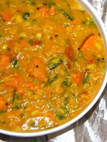 Vegan sweet potato vaal dal curry in white bowl.