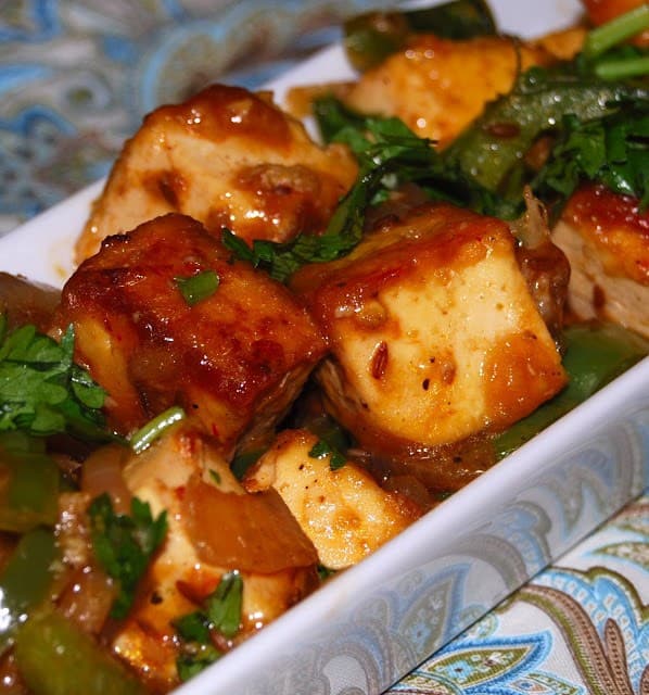 A close up shot of rich brown Chilli Tofu, Indo-Chinese style