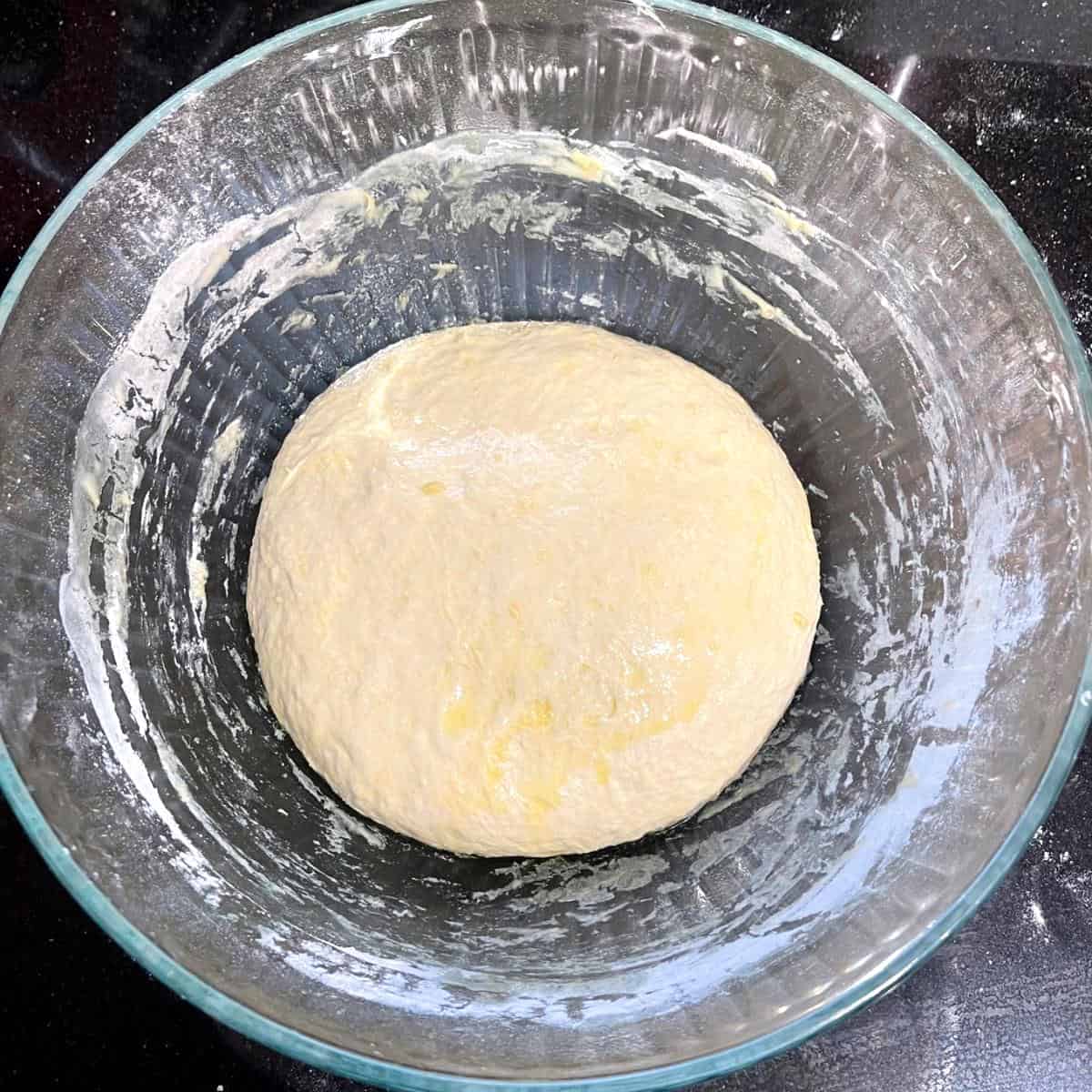 Italian bread dough in bowl before rising.