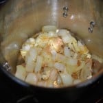 Onions and other veggies browning in stock pot for vegetable stock.