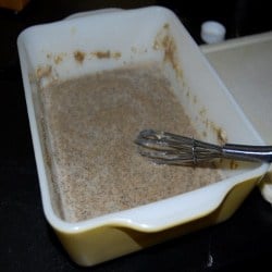 Flax egg mixture in baking dish with whisk.