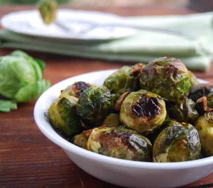 Front closeup of roasted brussels sprouts in a bowl.