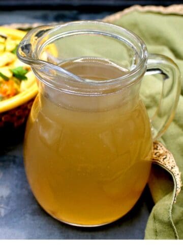 Vegetable stock in glass pitcher.