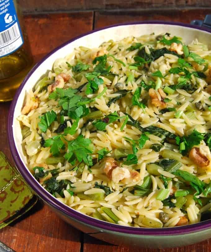 A bowl of pasta with Greens and Beans with olive oil and parsley