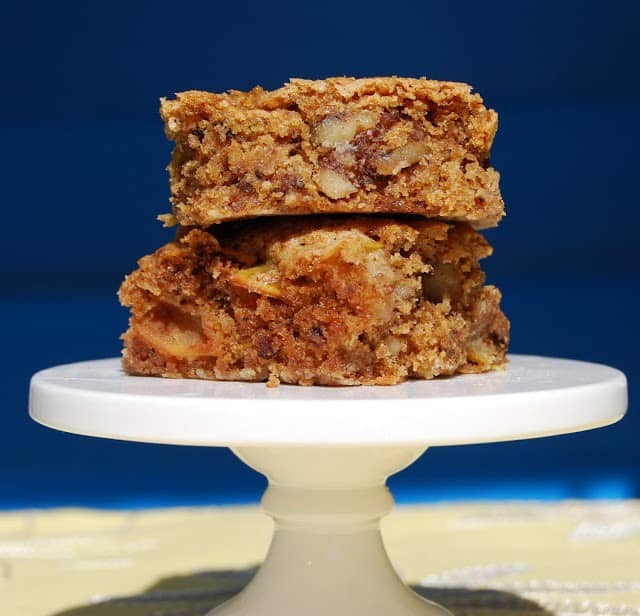 Stack of two Whole Wheat Apple Cake, slices on cake stand.