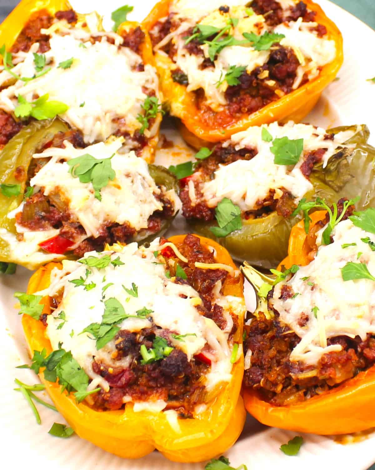 Stuffed bell peppers with a topping of vegan cheese.
