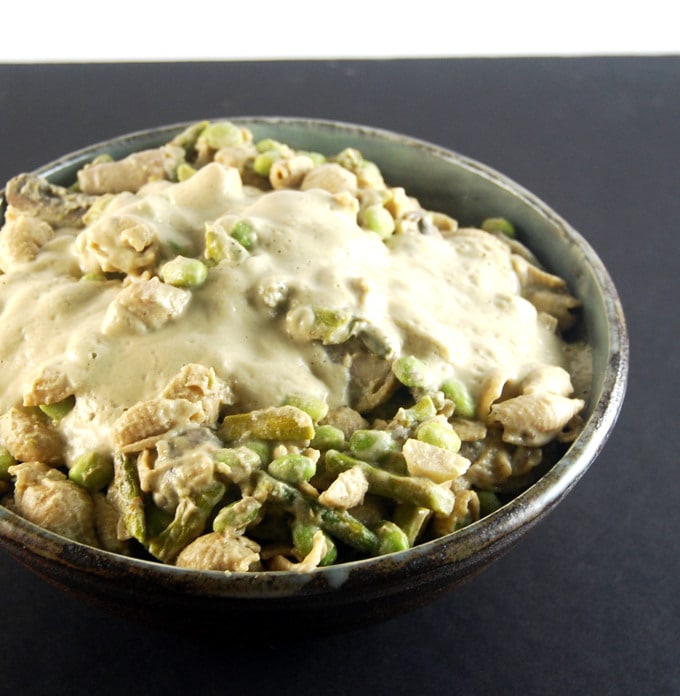 Roasted Cauliflower Cashew Sauce with pasta and veggies in a bowl.