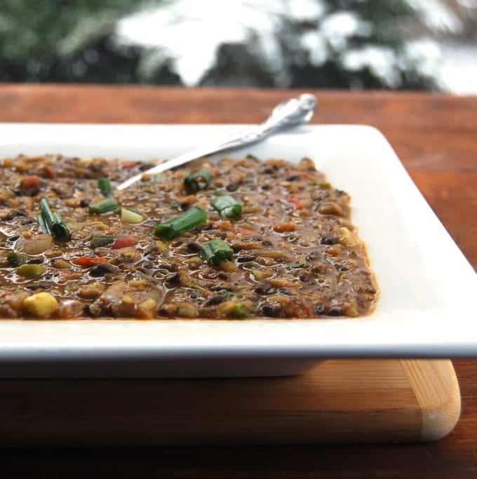 Vegan Dal Bukhara in plate with spoon.