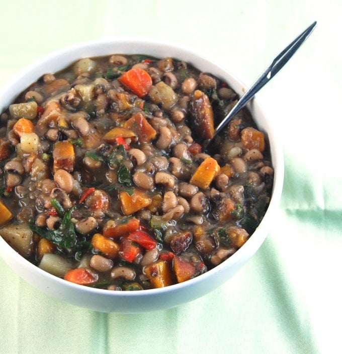 Black Eyed Peas Stew in bowl with spoon.