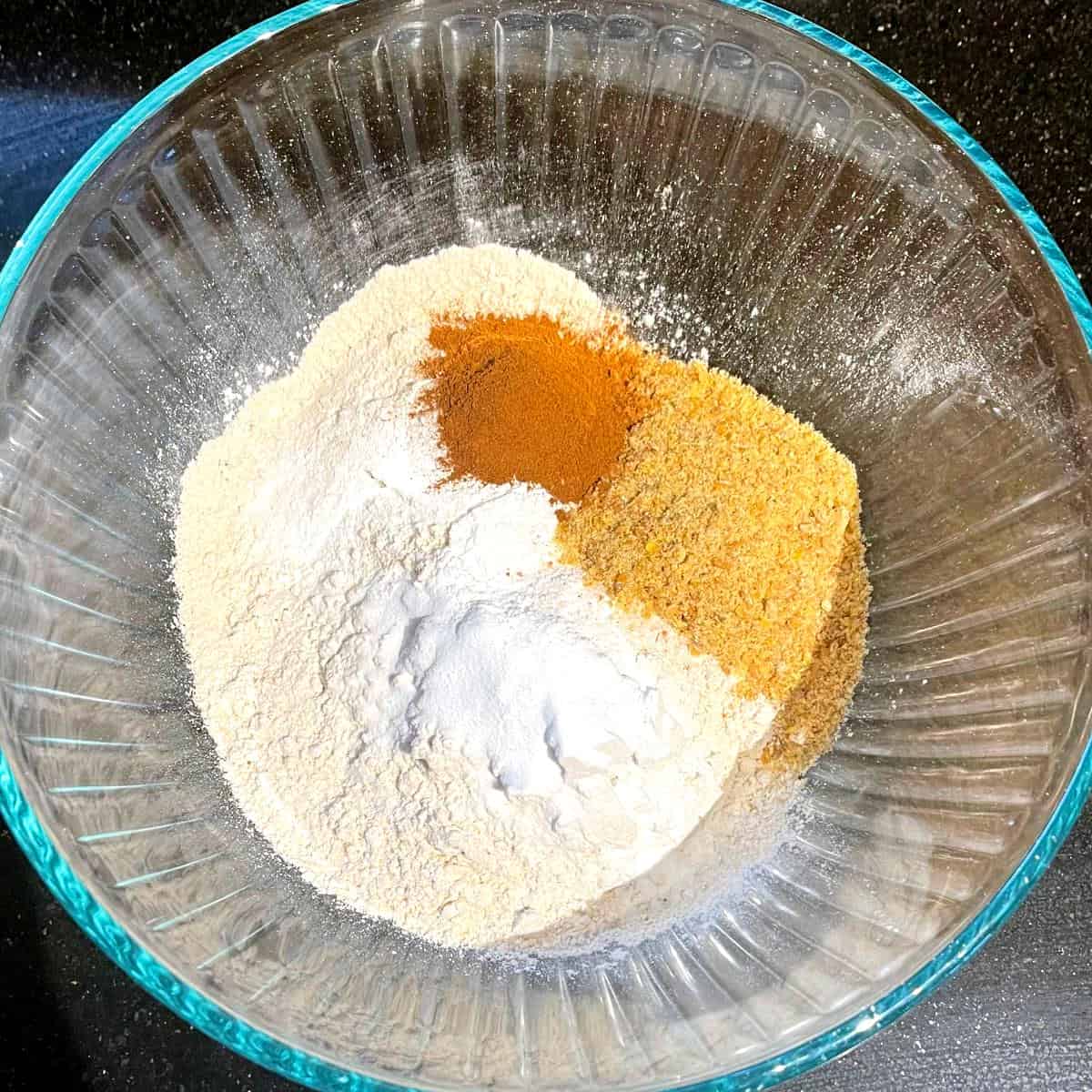 Dry ingredients for vegan sweet potato pancakes in bowl.