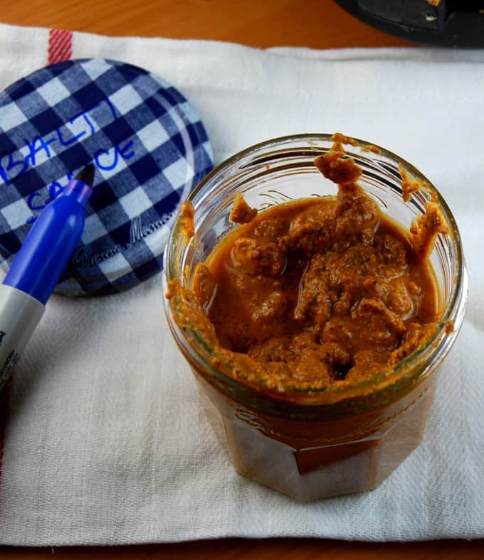 Photo of balti sauce in a glass jar.