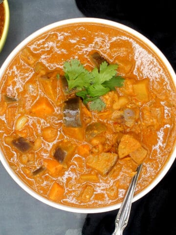 African peanut stew in bowl with spoon.