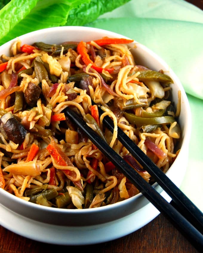 Veg Hakka Noodles, Indo-Chinese street food, in bowl with chopsticks.