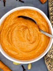 Tikka masala sauce in bowl with spoon.