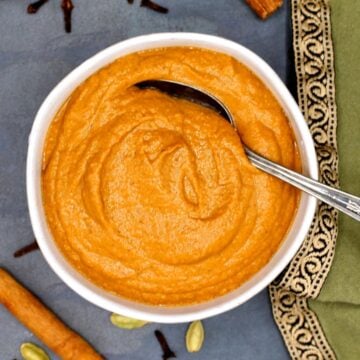 Tikka masala sauce in bowl with spoon.