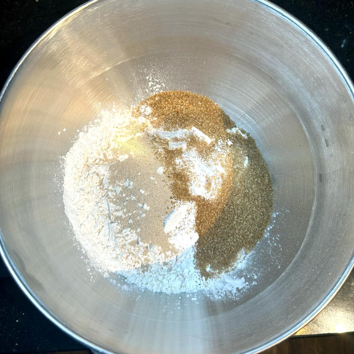 Dry ingredients for vegan babka dough in stand mixer bowl.