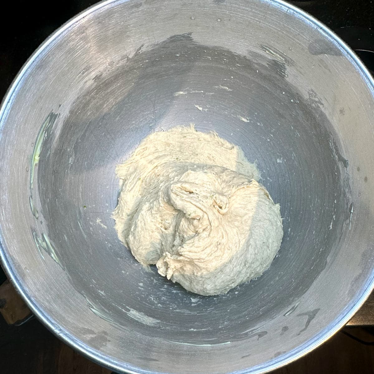Vegan babka dough after kneading in stand mixer bowl.