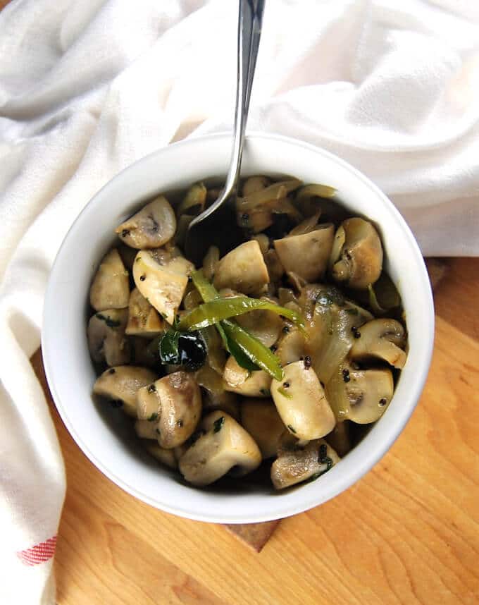 15-Minute Stir-Fried Mushrooms in white bowl with fork.