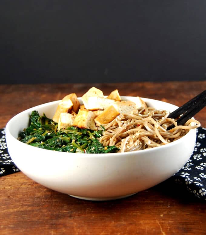 Healthy Sesame soba noodle bowl with spinach and tofu