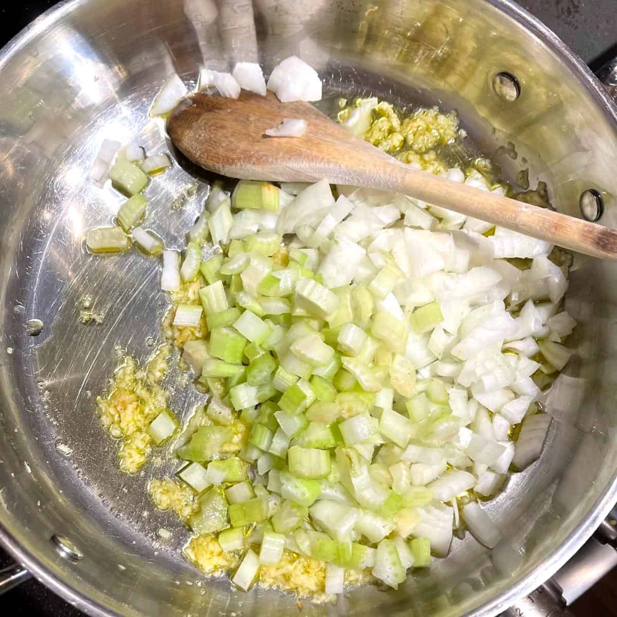 Celery, onions and garlic in saucepan.