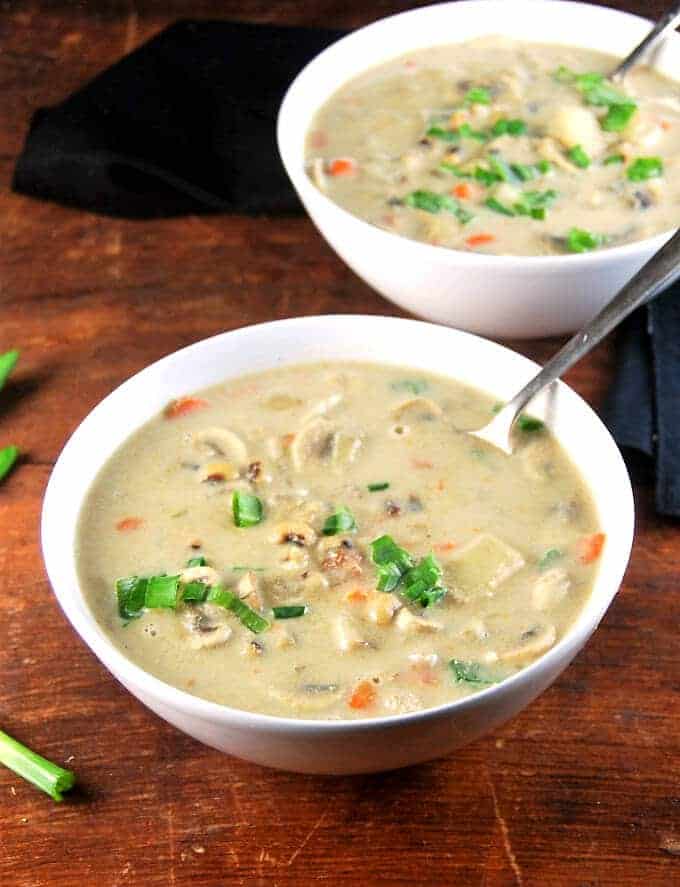 Creamy Curried Crock-pot Chowder in two white bowls.