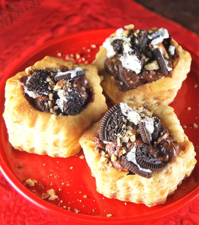 Vegan Chocolate Mousse Oreo Stuffed Puff Pastry Shells on red plate.