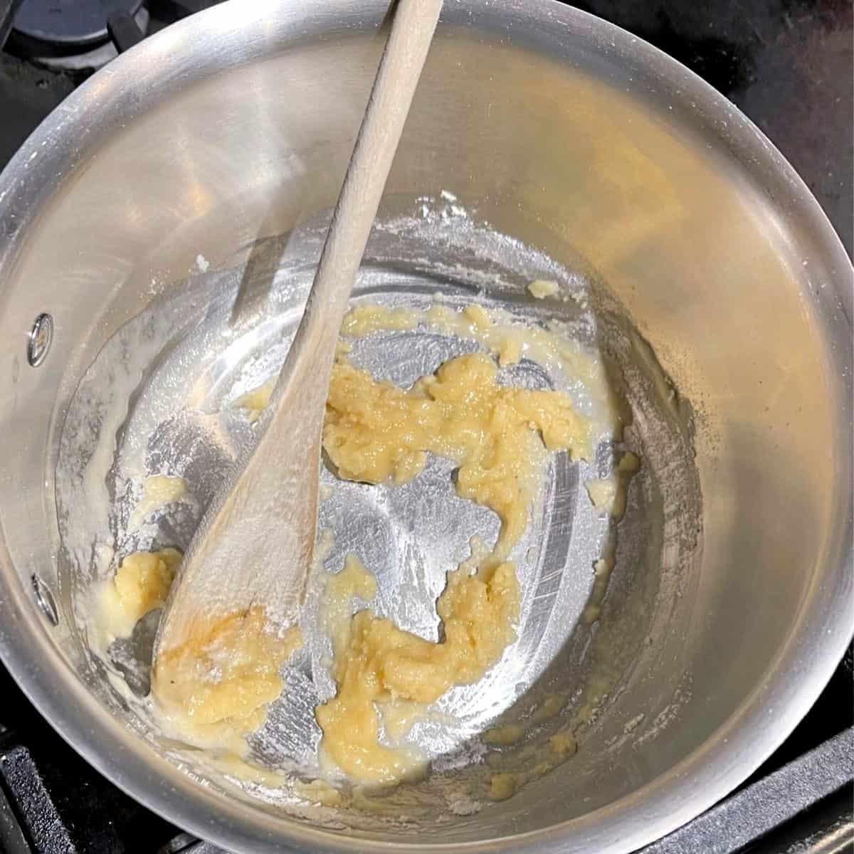 Flour added to butter in saucepan.