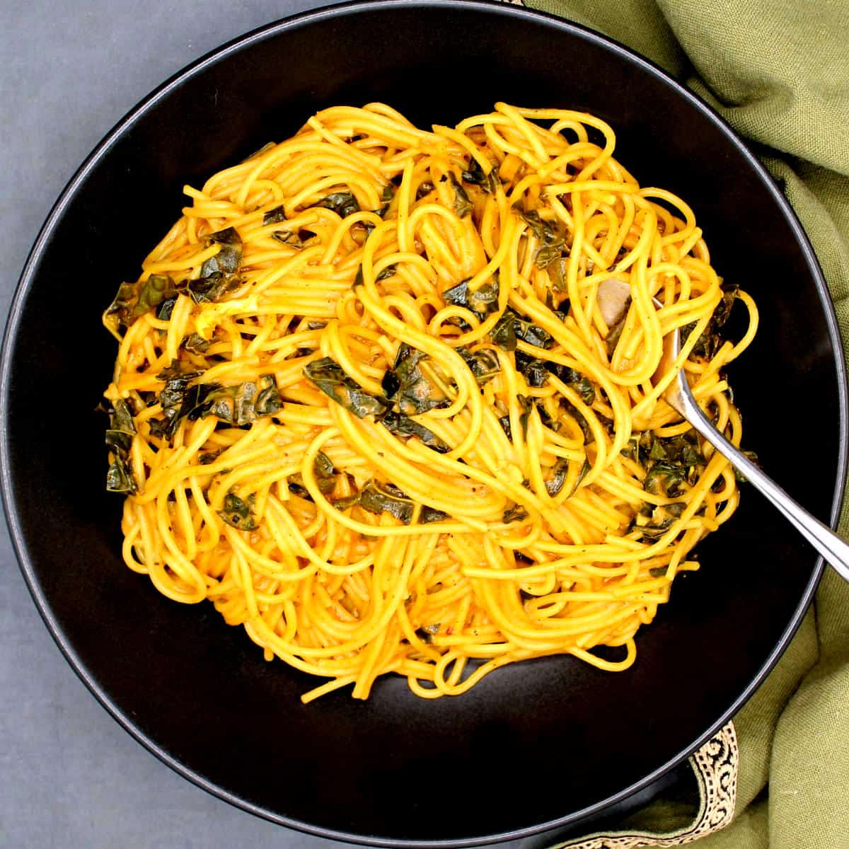 Photo of curried spaghetti in bowl.