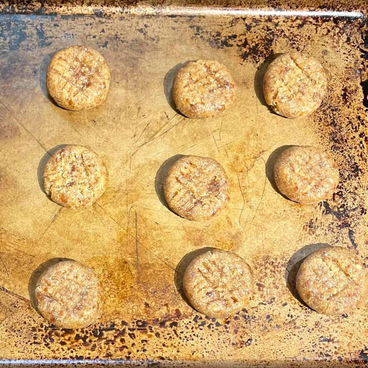 Vegan almond flour cookies on baking sheet before baking.