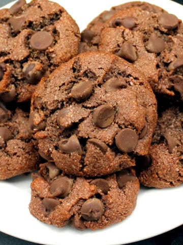 Vegan almond flour chocolate chip cookies in white plate.